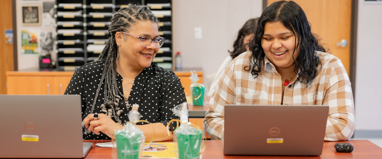 a student being helped by a staff member